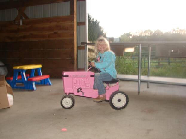 Abby on Her Pink-Pedal Tractor